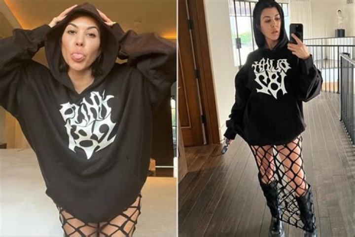 
Kourtney Kardashian Preps for Travis Barker’s Blink-182 in Black Fishnet Dress: ‘Ready to Mosh’ 